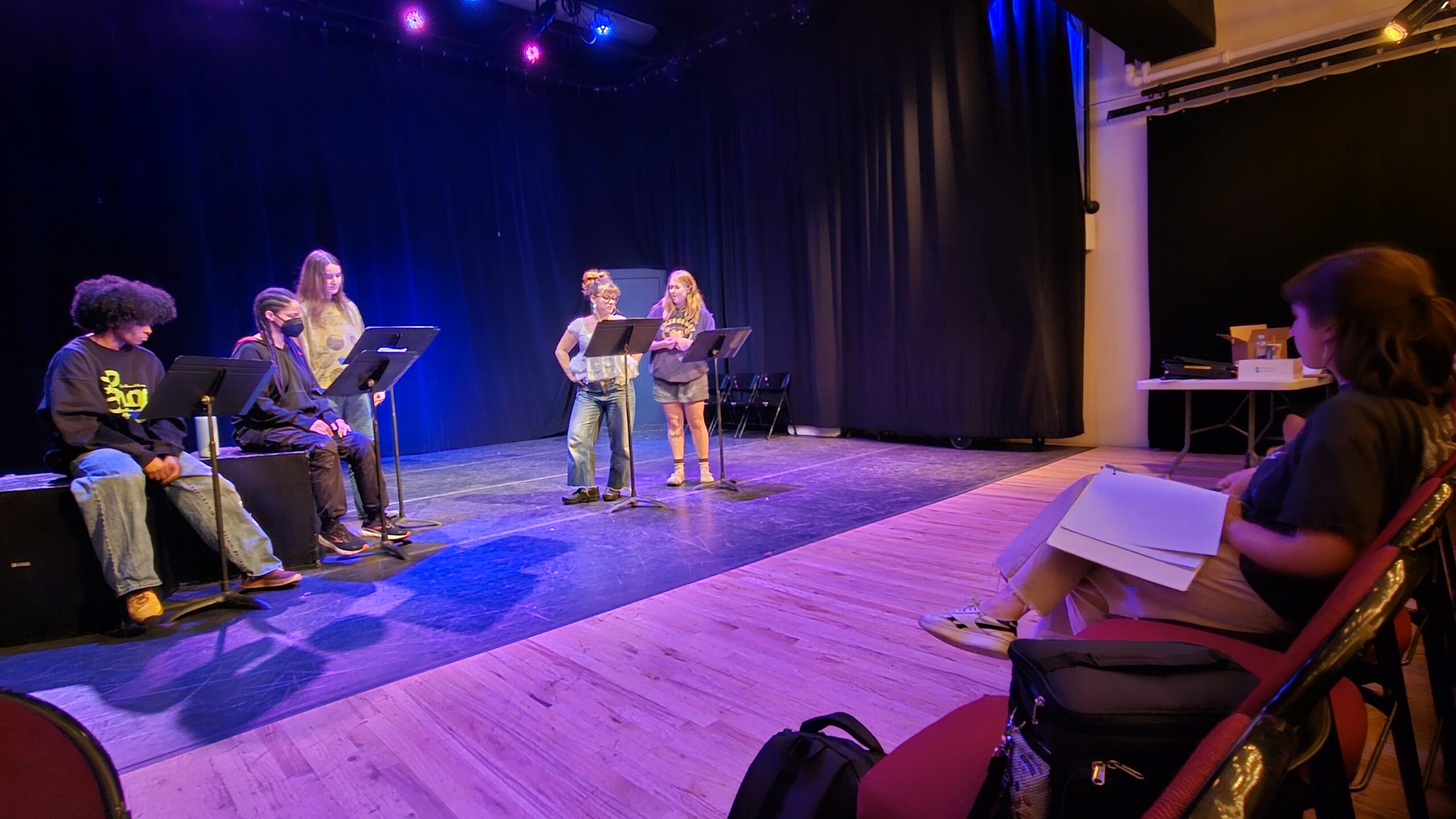 students rehearsing on stage for new play festival
